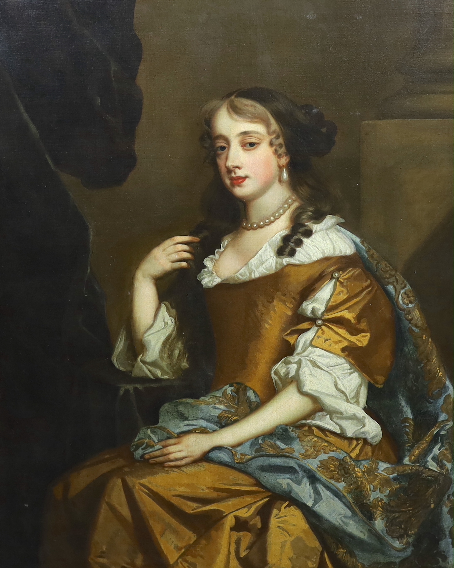 Studio of Sir Peter Lely (1618-1680), Portrait of Henrietta Hyde (née Boyle), Countess of Rochester, (1646-1687) three quarter length, in a gold dress, wearing a gold-embroidered blue mantle, seated by a pilaster, oil on